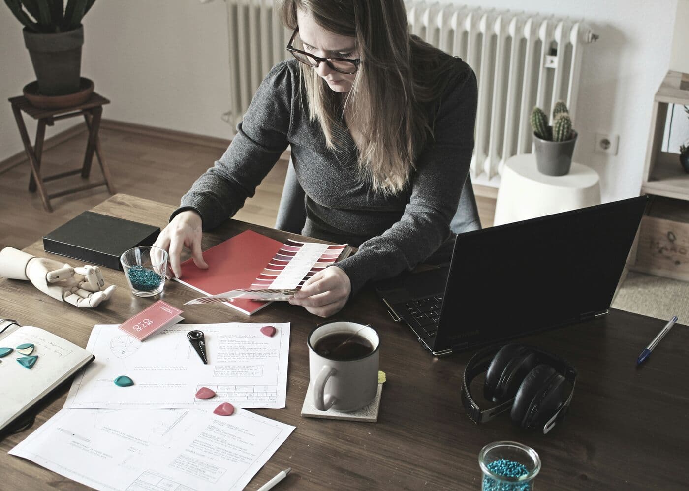 An HR leader reviewing plans at a desk